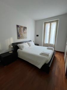 Voodi või voodid majutusasutuse Bilocale Zona Tortona toas