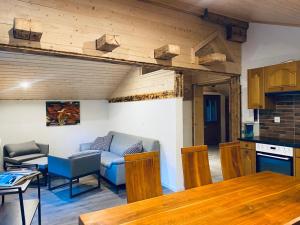 a living room with a couch and a table at Chalet Bärgstäger in Lauterbrunnen
