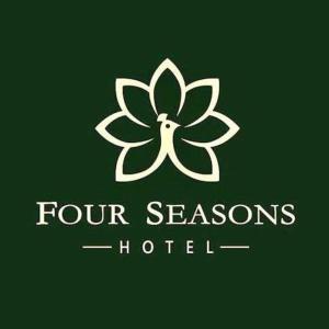 a four seasons hotel logo with a four leaf clover at OYO Four Seasons Hotel in Meerut