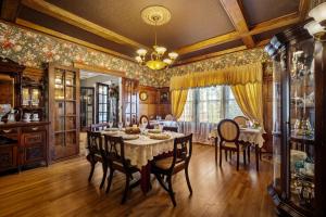 a dining room with a table and chairs at The Inn on Front Street in Statesville