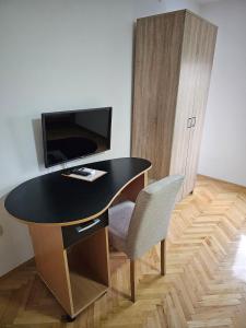 TV in/ali zabaviščno središče v nastanitvi Akvarius