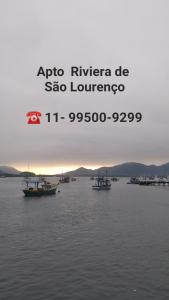 a group of boats in a large body of water at Apartamento na Riviera de São Lourenço in Riviera de São Lourenço