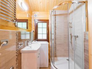 a bathroom with a shower and a sink and a toilet at Cottage in Ustronie Morskie near Aquapark in Ustronie Morskie +17 photos