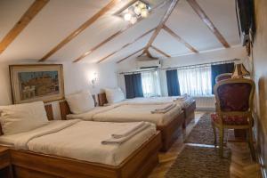 Letto o letti in una camera di Hotel Herc Sarajevo