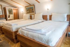 Letto o letti in una camera di Hotel Herc Sarajevo