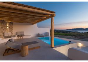 a villa with a swimming pool and a wooden roof at Leuki Villa Milos in Adamas