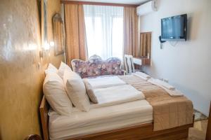 Letto o letti in una camera di Hotel Herc Sarajevo