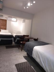 Posteľ alebo postele v izbe v ubytovaní Hotel Cocó Cochoa