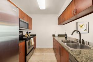 a kitchen with a sink and a stove at Luxury 1BD Apt in Downtown Brickell free parking in Miami