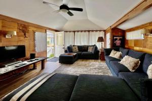 a living room with a couch and a ceiling fan at Catalina Island Cottage - Walk to Main St and Beach! in Avalon