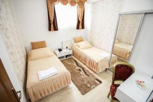 Letto o letti in una camera di Hotel Herc Sarajevo