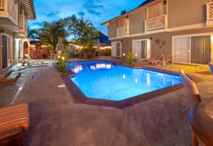 a swimming pool in the backyard of a house at Studio Boutique Resort Across from Beach in Kihei