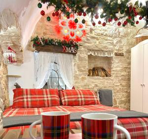 a living room with a couch and a fireplace at Domus Klara in Turi