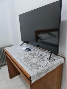 a flat screen tv sitting on top of a table at Happy pyramids inn Hotel in Cairo