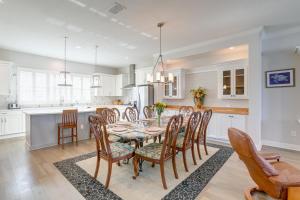 a kitchen and dining room with a table and chairs at Modern Redington Beach Townhome Steps to Beach! in St Pete Beach