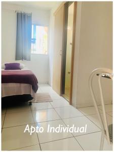 a bedroom with a bed and a door to a doorway at Pousada Estrela Veadeiros in Alto Paraíso de Goiás +46 photos