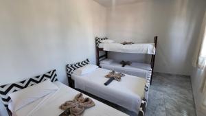 Postel nebo postele na pokoji v ubytování Tamboleiros Hotel & Hostel