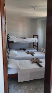 Postel nebo postele na pokoji v ubytování Tamboleiros Hotel & Hostel