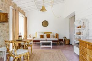 a living room with a table and a couch at Casa Brava - Algarve in Loulé