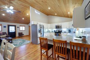 a kitchen with a table and chairs in a room at Peaceful Spruce Pine Cabin with Fire Pit! in Spruce Pine