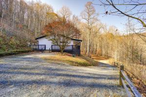 a house on the side of a road at Peaceful Spruce Pine Cabin with Fire Pit! in Spruce Pine