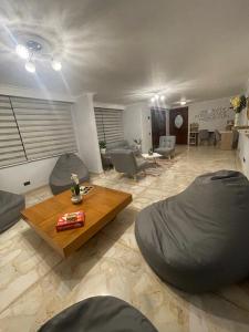 a living room with two bean bag chairs and a table at Habitación Privada Y Cómoda Medellin -Laureles 5 in Medellín