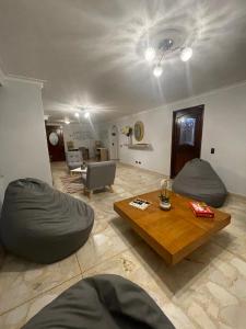 a living room with two bean bags and a table at Habitación Privada Y Cómoda Medellin -Laureles 5 in Medellín