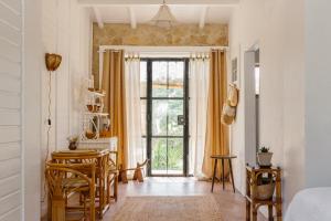 a room with a table and chairs and a window at Casa Brava - Algarve in Loulé +72 photos