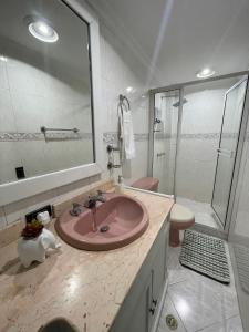 a bathroom with a sink and a shower and a toilet at Habitación Privada Y Cómoda Medellin -Laureles 5 in Medellín