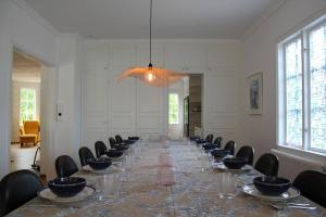 a long dining room with a long table and chairs at Beach House Ängelholm in Ängelholm