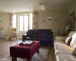 a living room with a couch and a coffee table at Gate lodge at Lough Erne Golf Village in Ballycassidy