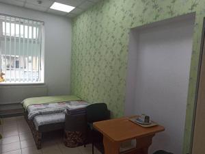Postel nebo postele na pokoji v ubytování Старий Дворик,кімнати біля жд вокзалу