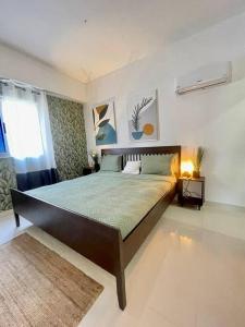 Ένα ή περισσότερα κρεβάτια σε δωμάτιο στο Apartamento vista al mar cerca universidad malecón zona colonial