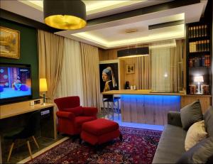 a living room with a couch and a bar at NY-GOLDEN APARTMENTS-Dortmund Airport in Dortmund