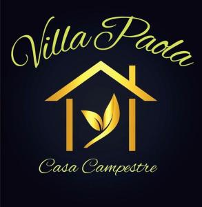 a gold logo with a house and a leaf at Cabañas VILLA PAOLA in Rivera