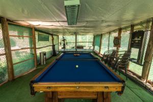 a room with a pool table in a tent at Bungalow RURU WASI in Urubamba