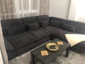 a black couch in a living room with a table at Beautiful,central, two bedrooms apartment in Castello in Castellón de la Plana