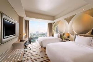 Postelja oz. postelje v sobi nastanitve DoubleTree by Hilton Jakarta - Diponegoro
