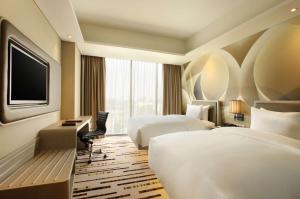 Postelja oz. postelje v sobi nastanitve DoubleTree by Hilton Jakarta - Diponegoro