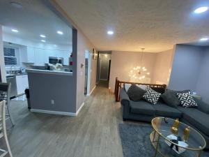 a living room with a couch and a kitchen at Home in Tobyhanna, Poconos Mountain, Pennsylvania in Tobyhanna