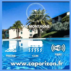 ein Schild für ein Hotel in der Nähe eines Pools in der Unterkunft Caporizon-Baillenia-T1 Vue Montagne - Piscine St Jean de luz in Saint-Jean-de-Luz