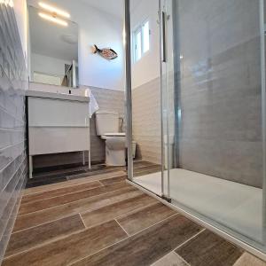 a bathroom with a shower and a toilet at La Pérgola Calma in San Bartolomé de Tirajana