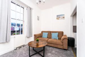 a living room with a couch and a table at May Disc - Long Stay - Contractors in Bristol