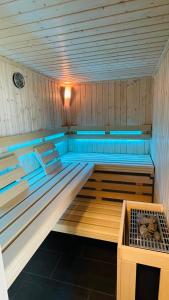 a sauna with a bed in the middle of it at Kleine Burg Ovelgönne in Ovelgönne