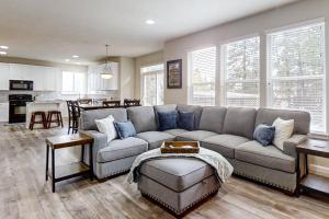 a living room with a couch and a kitchen at Around the Bend in Bend