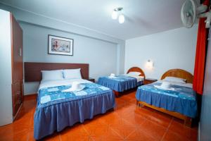 מיטה או מיטות בחדר ב-Hotel Mayros