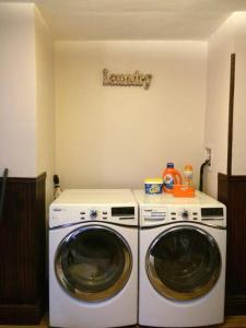 a laundry room with a washer and dryer at Garden Apartment with Private Entry in Brooklyn