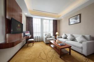 TV a/nebo společenská místnost v ubytování Honglilai Hotel