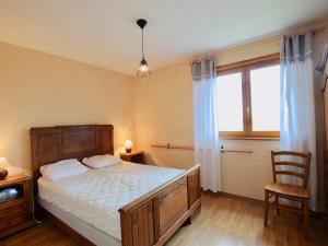 a bedroom with a large bed and a window at Villa Publier, 5 pièces, 8 personnes - FR-1-498-24 in Publier
