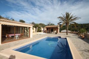 a villa with a swimming pool and a house at Santa Ana - pretty holiday property with garden and private pool in Benissa in Benissa